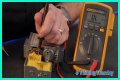 How do you test a Honeywell gas valve with a multimeter?